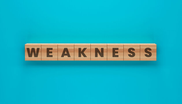 Weakness in Wooden Blocks: Weakness spelled out on wooden blocks, set against a vibrant turquoise backdrop. Emphasizes the significance of recognizing vulnerabilities.