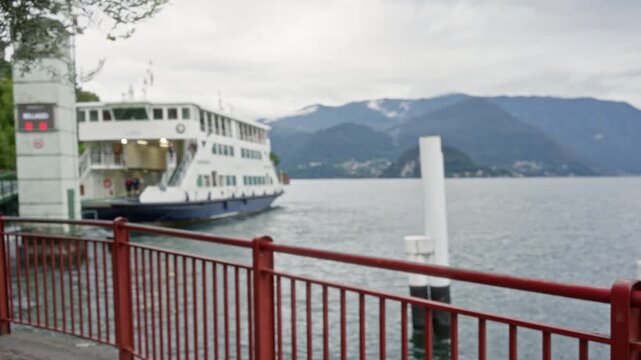 Blurred lakeside ferry with red railing in soft bokeh background outdoor; background backplate copyspace calm.