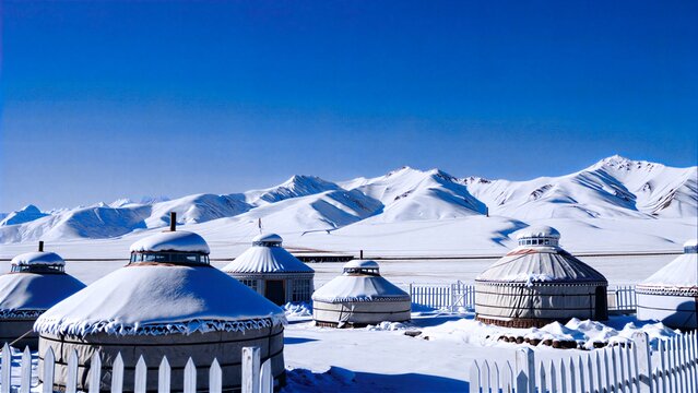Yurts Covered With Snow Under Snowy Mountains