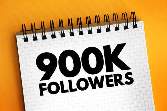 900K Followers - reaching 900,000 followers on a social media platform or other online platform, text concept on notepad