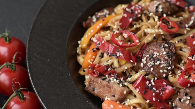 Food, Chinese or Japanese noodles with meat, vegetables, and spices. Noodles with beef or chicken as a food background for your design