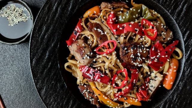 Food, Chinese or Japanese noodles with meat, vegetables, and spices. Noodles with beef or chicken as a food background for your design