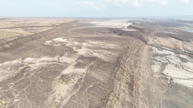 Aerial view of the vast arid landscape and deep canyons of the Danakil Desert Dalol, Afar, Ethiopia.
