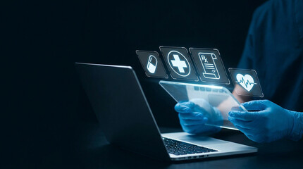Hands typing on laptop with digital health icons and holographic medical interface © Beatriz