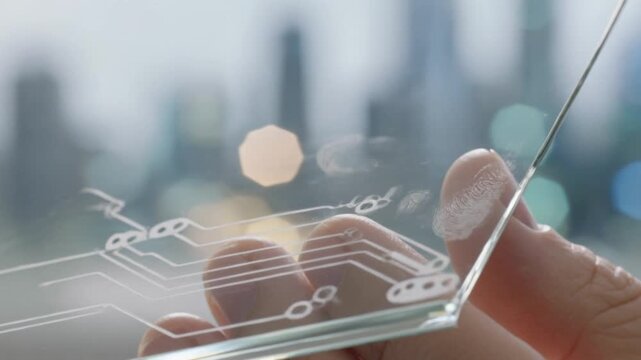 Macro shot of a person holding a transparent glass microchip with glowing etched circuits and digital fingerprints