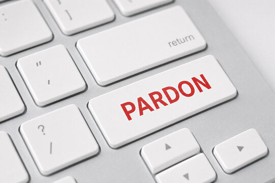 Keyboard with a red pardon key on white keys