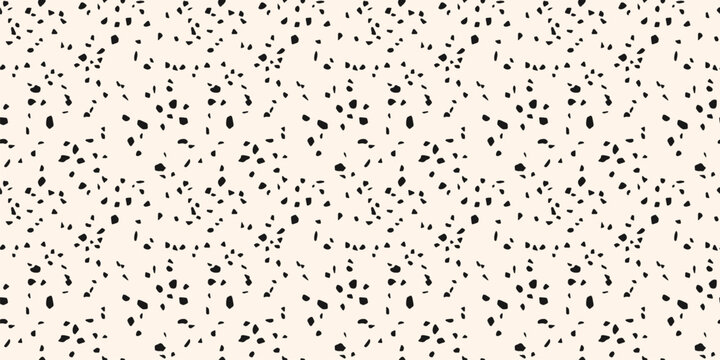 Monochrome vector terrazzo texture. Minimalist seamless pattern with small chaotic scattered cutout shapes. Terazzo flooring background. Mosaic floor surface. Simple black and white repeated design
