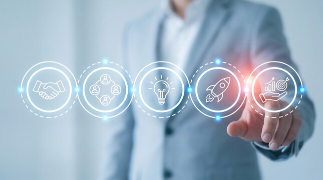 Businessman interacting with digital interface showing business growth icons for startup success and corporate strategy development