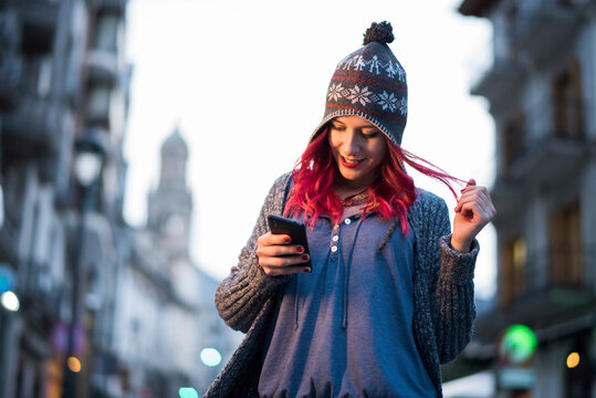 Women in the city using smartphone