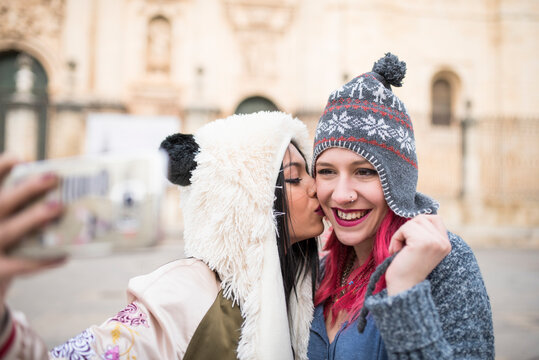  women in the city kissing in european city
