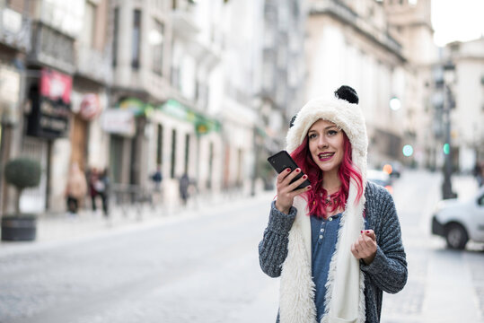 woman talking with phone in city