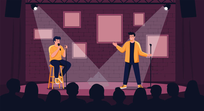 Two male stand up comedians performing their comedy routine with microphones on a dark stage with spotlights and an audience in the foreground view.