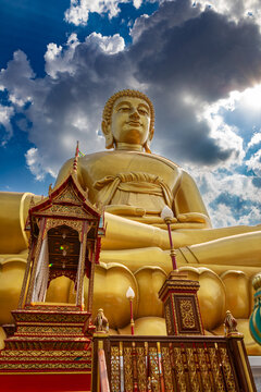 Bangkok, Thailand - March 15 2026 : The giant seated buddha statue at the Wat Paknam Phasi Charoen temple, Famous place in Bangkok.