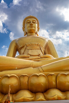 Bangkok, Thailand - March 15 2026 : The giant seated buddha statue at the Wat Paknam Phasi Charoen temple, Famous place in Bangkok.