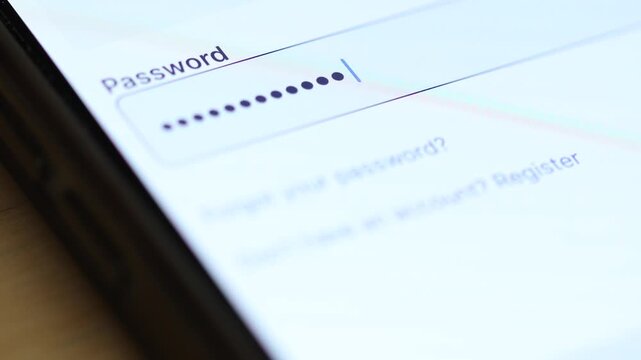 4K macro shot of a security password field on a smartphone being filled with hidden dots as the user types character by character.