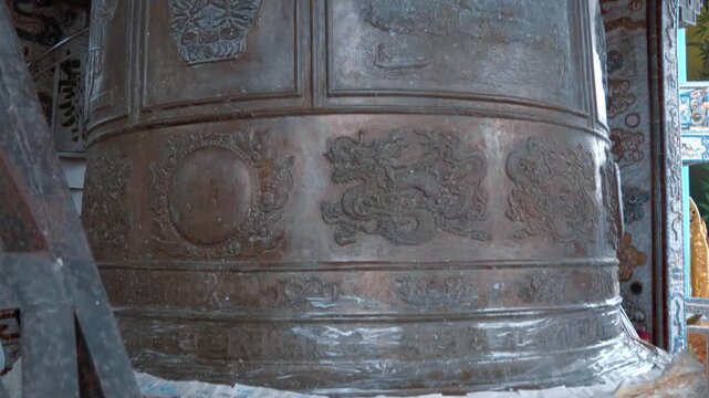 On the tallest bell tower in Vietnam 36 meters high and featuring a massive 8,500 kg metal bell covered with symbolic Buddhist carvings. The bell room is covered with colorful mosaics depicting sacred