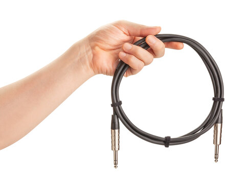 audio trs cable in hand path isolated on white