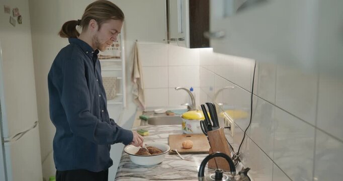 Caucasian man prepares desert at kitchen at home. 4K 10-bit