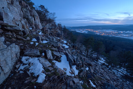 Blue hour view over a winter valley in Brdy
