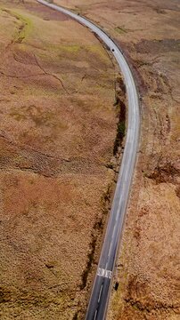 Carter Bar Scotland: 14th March 2026: Drone view of the A68 road winding through Cheviot Hills, on the Anglo-Scottish border on a sunny Springtime day