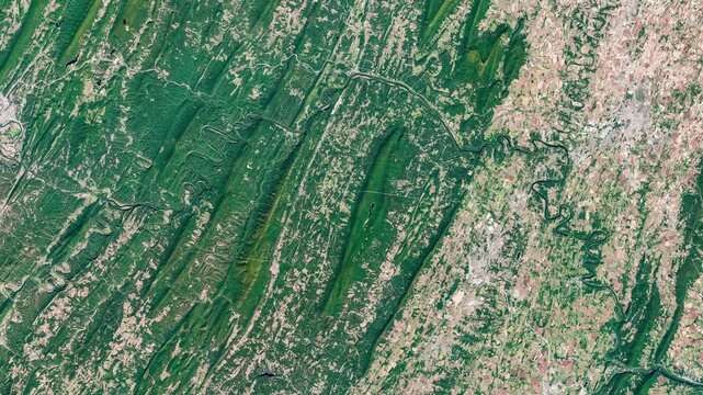 Aerial view on green and agricultural zone with meanders of rivers. Camera is zooming in, rotating clockwise. Animation based on image by NASA