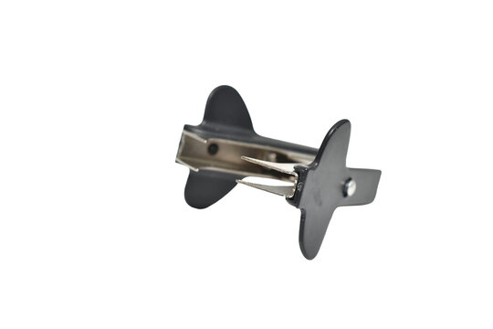 Universal black staple remover for removing staples from paper isolated on white background.