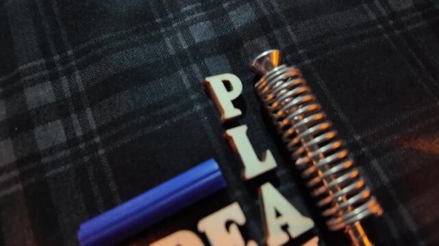 The words 'IDEA' and 'PLAN' are arranged with a spring and blue elements.