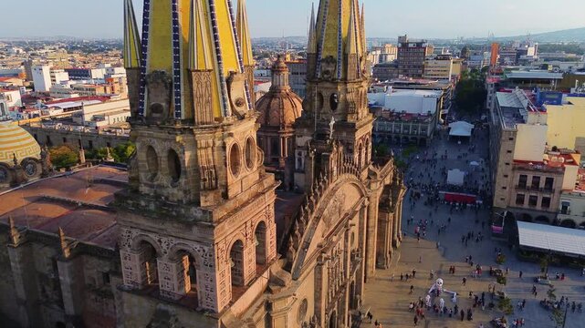 Guadalajara Cathedral Main Facade Aerial Drone Orbit Movement at One Hundred Meters Altitude during a Beautiful Sunset with Downtown Cityscape Background in Jalisco Mexico