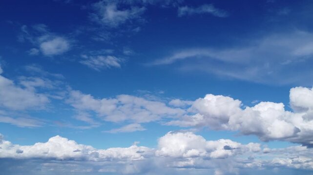4K aerial drone view of white fluffy clouds against a vibrant blue sky, cinematic transition through beautiful cloud layers, peaceful summer day, high altitude perspective, bright and airy weather 