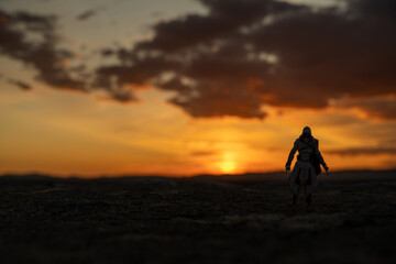 Monteriggioni, Italy - 16 Sep 24: Figurine silhouette at sunset on Monteriggioni wall © Joseph Creamer