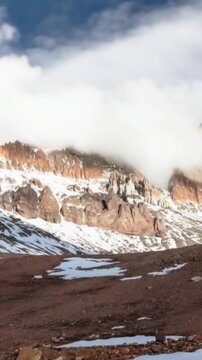 Aconcagua, a mountain in the Andes Mountains between Chile and Argentina. Time lapse in vertical video