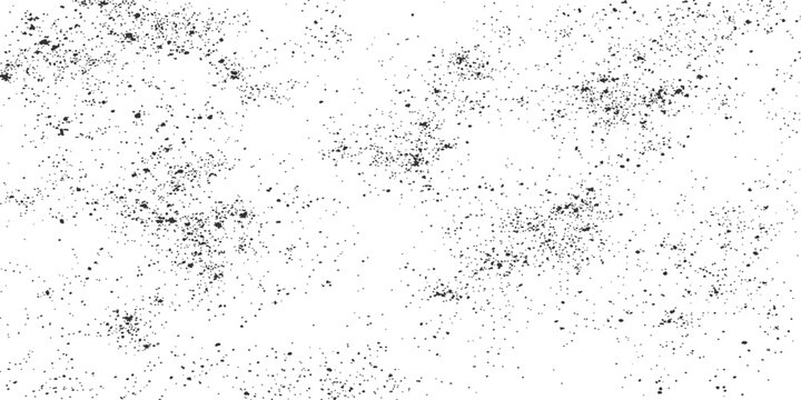 Black speckles and dots texture on a white background abstract grainy pattern