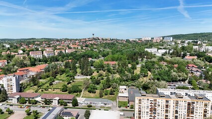 Naklejka premium Aerial view of Komló city center and surrounding hills