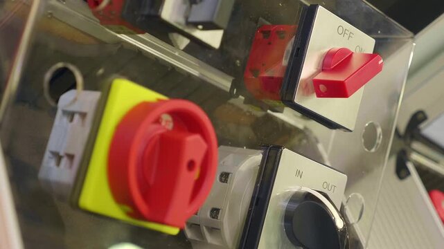 New industrial on-off switches for equipment. Closeup. Shallow depth of field. Follow focus
