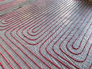 Fototapeta premium Installation of underfloor heating system in building, above view