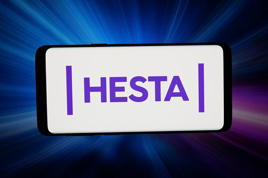 Stuttgart, Germany - 05-13-2026: In this photo illustration, the logo of fund H.E.S.T. Australia Ltd. (HESTA) is displayed on a smartphone in front of abstract background on computer screen.