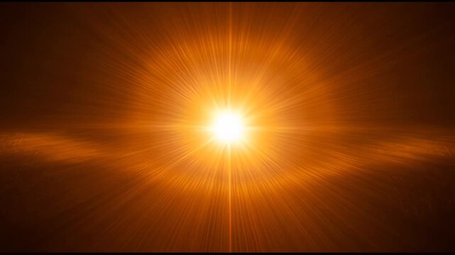 Intense sun burst radiating bright golden light through dark sky