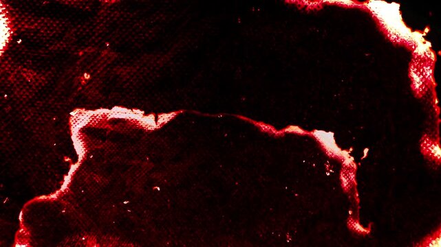 Fiery paper burn effect with a dark background, ideal for transitions and dramatic visuals.