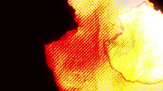 Fiery red and yellow texture with a grainy pattern, transitioning to black. Great for backgrounds.