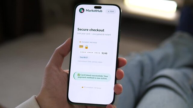 Linking a credit card on a mobile app for a secure checkout. Hands tap to connect a payment method. Perfect for e-commerce videos, fintech, and online transaction security.