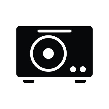 Silhouette of a classic speaker cabinet with circular grille and control knobs on a plain background