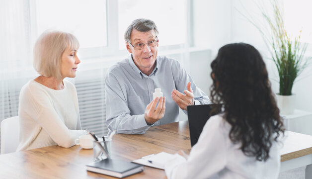 Consult Your Doctor. Senior man asking his nurse about indications and contraindications of new medicine, copyspace