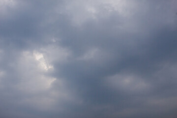 Fototapeta premium The background view of the sky is dominated by thick and dark clouds, which is often associated with cloudy weather or about to rain.