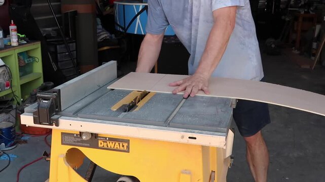 table saw cutting short end of a piece of plywood