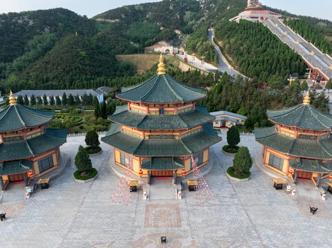 Aerial view of the triple-hall temple complex at Lingshan Temple in Luoyang Henan with traditional Chinese architecture and mountainous backdrop
