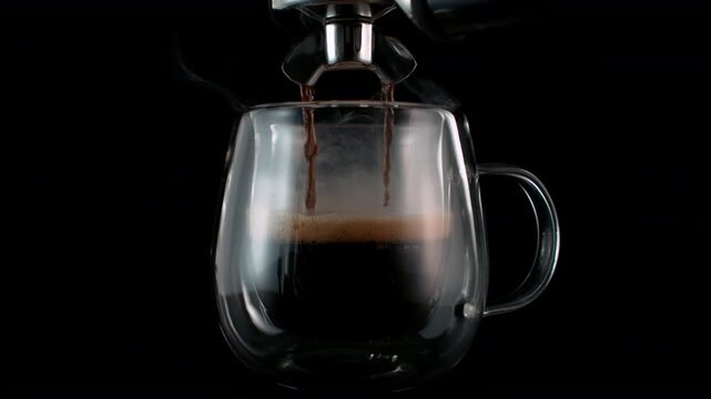 Super Slow Motion of Pouring Espresso Isolated on Black Background with Camera Motion at 1000fps.