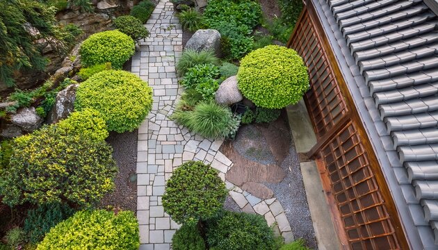 zen garden aerial perspective with lush foliage tranquil stone path and rustic rooftop texture