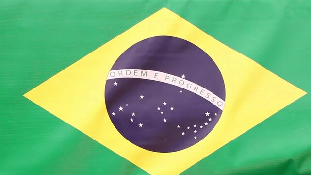 Traditional Lebanese and Syrian kibbeh shaped like a heart held in front of Brazilian flag, Middle Eastern cuisine concept featuring fried bulgur croquette with sesame seeds and cultural fusion food p