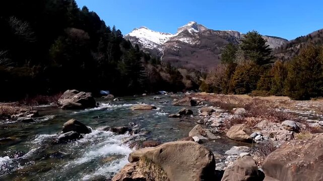 The Bujaruelo Valley, through which the Ara River flows, along with the mountains, the melting snow of the Aragonese Pyrenees, Ordesa y Monte Perdido National Park, the Pyrenees, Huesca, 
