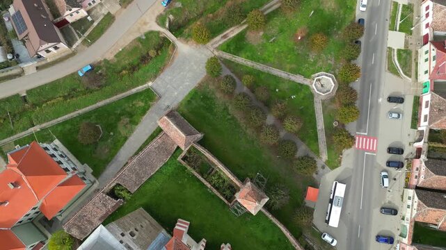High angle view of the restored Rupea medieval citadel built on a basalt rock in Brasov, Transylvania. Spectacular historic Saxon fortress in a scenic Romanian rural landscape.